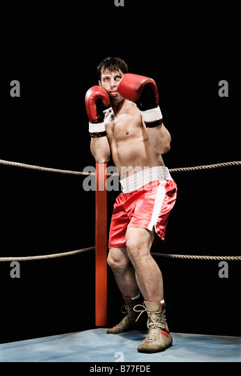 boxer-standing-fighting-stance-boxing-ring-b77fde.jpg