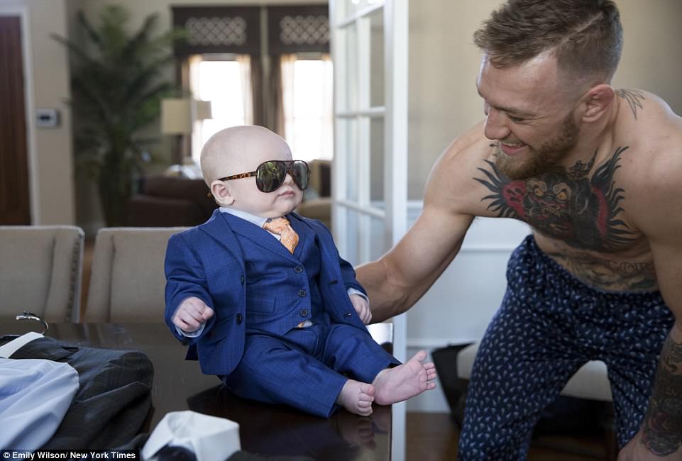 4383BC2800000578-4819284-Conor_McGregor_was_clearly_enjoying_having_his_son_Conor_Jr_dres-a-1_1503637769482.jpg