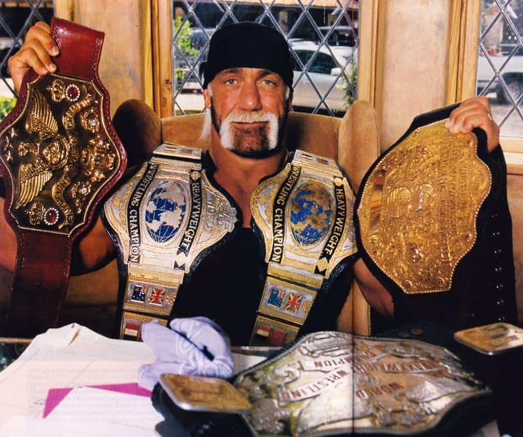 Hulk-Hogan-WWE-banner-championship-belts-e1474048520729.jpg