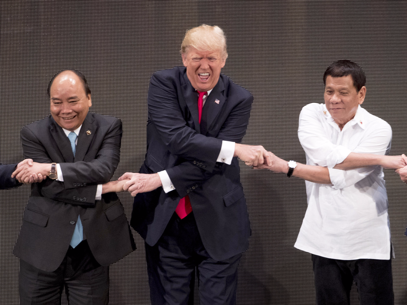 the-internet-is-loving-trumps-latest-awkward-handshake-from-his-asia-trip.jpg